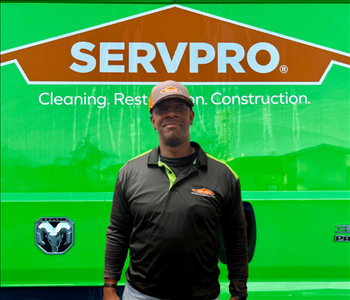 tech in front of Servpro van