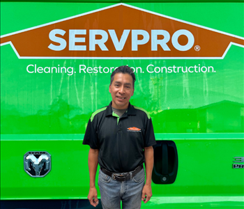 tech in front of Servpro van