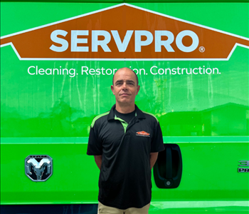 tech in front of Servpro van