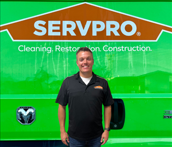 tech in front of Servpro van